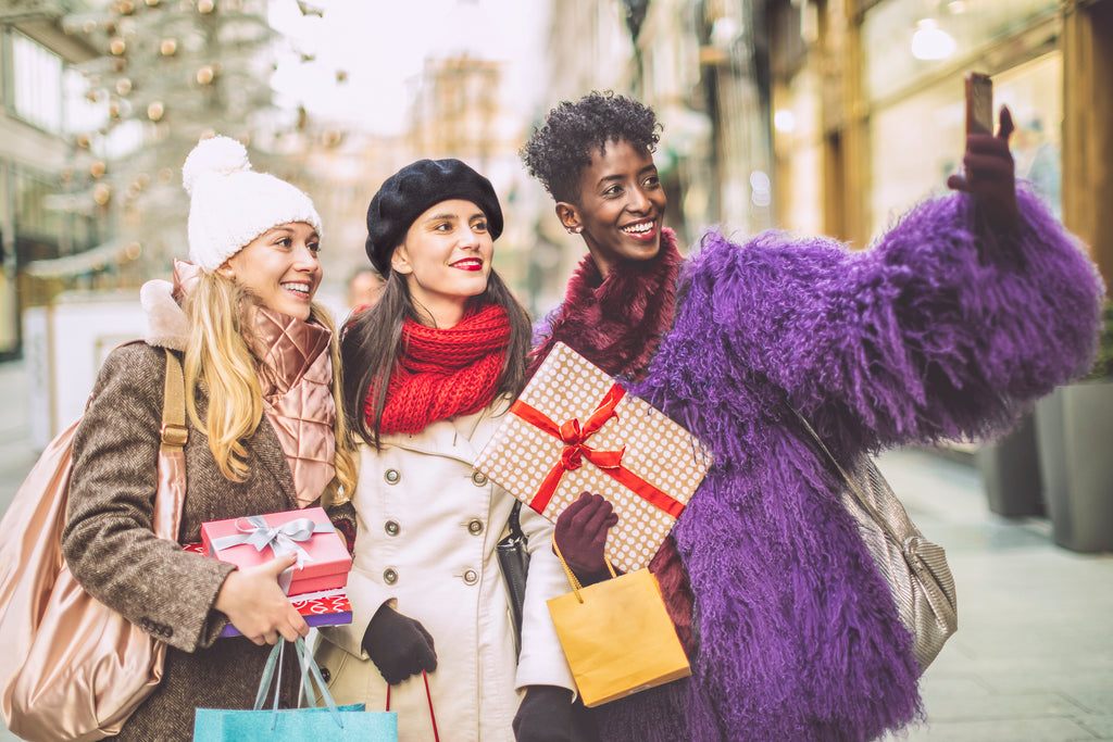 women holiday shopping taking selfie