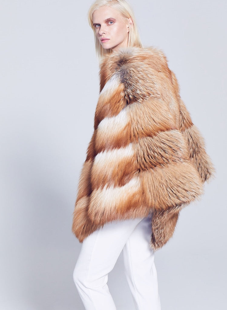 gold fox fur over the head poncho side view styled with white pants