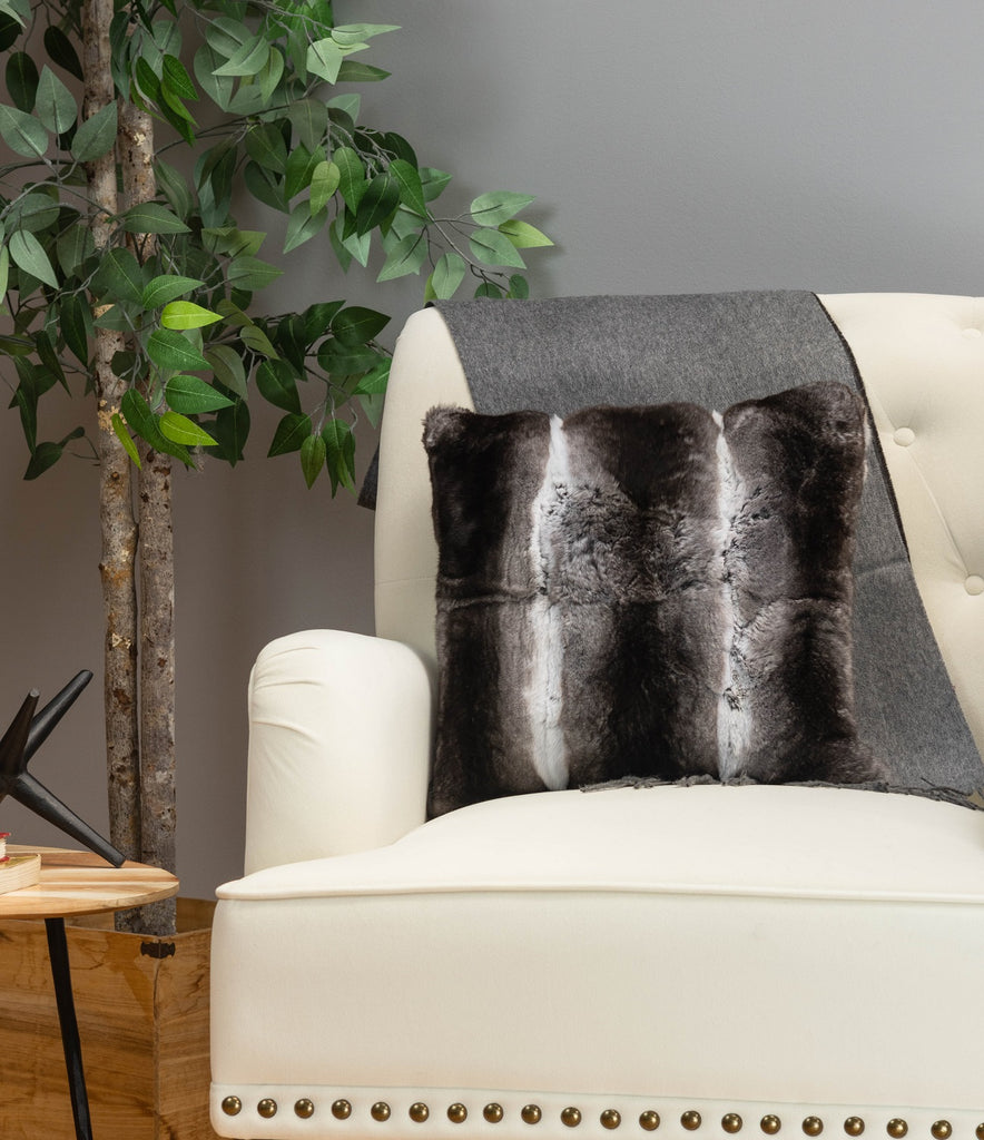 chinchilla fur pillow on white sofa chair in living room