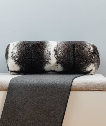 black and white cross mink fur pillow set on bench for interior design