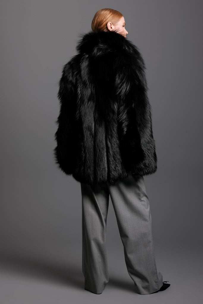 black silver fox jacket back detail of fur on woman wearing grey pants