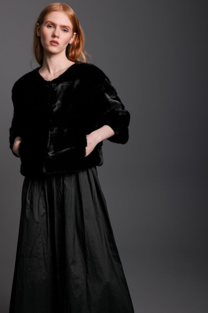 black mink fur bolero on woman wearing black dress
