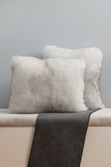 blue fox fur pillow set on bench for interior design