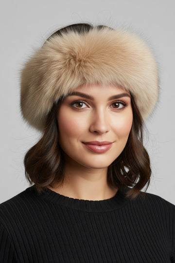 woman wearing a blush tone fox fur headband with velcro closure and black sweater