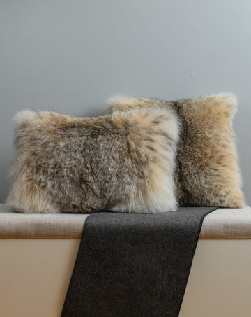 canadian lynx fur pillow set on bench for interior design