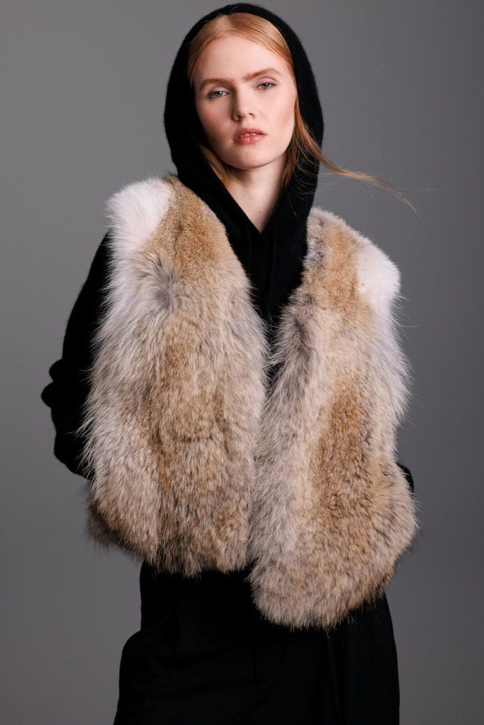 coyote cropped fur vest on woman closeup with black hoodie 