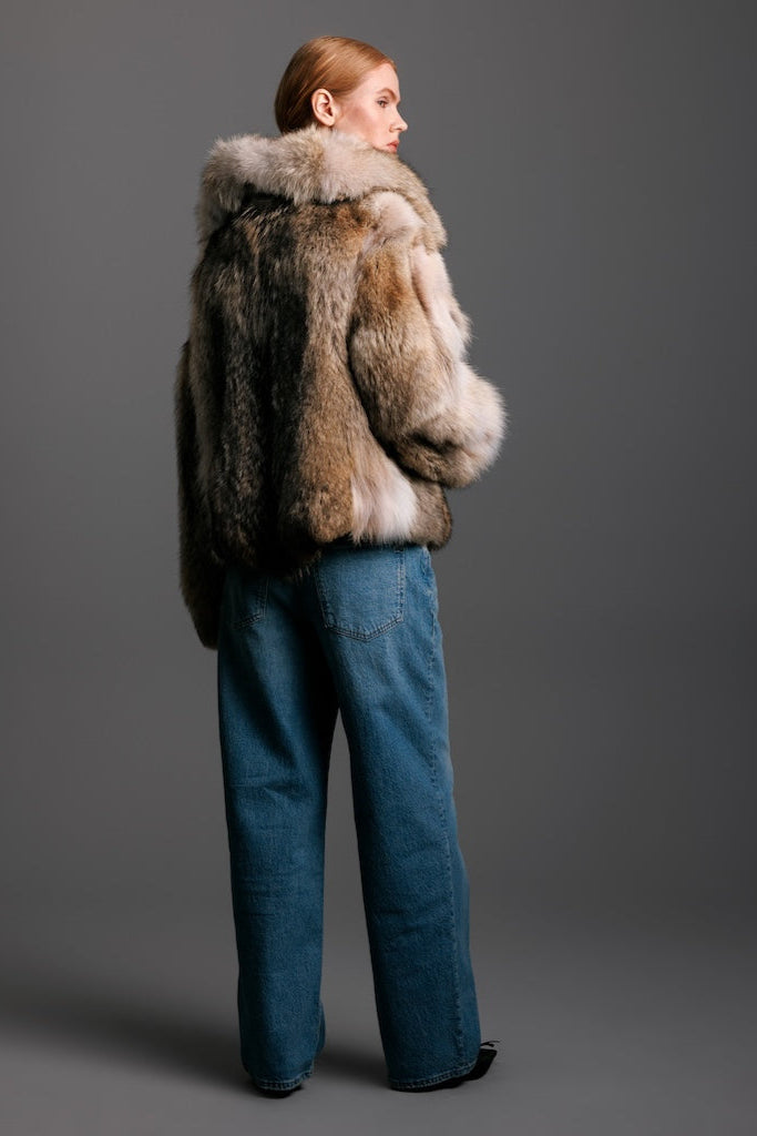 woman wearing coyote fur jacket with detail backside view