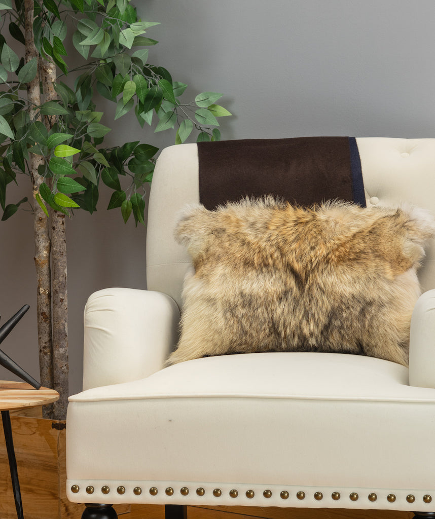 coyote fur pillow on white sofa chair in living room