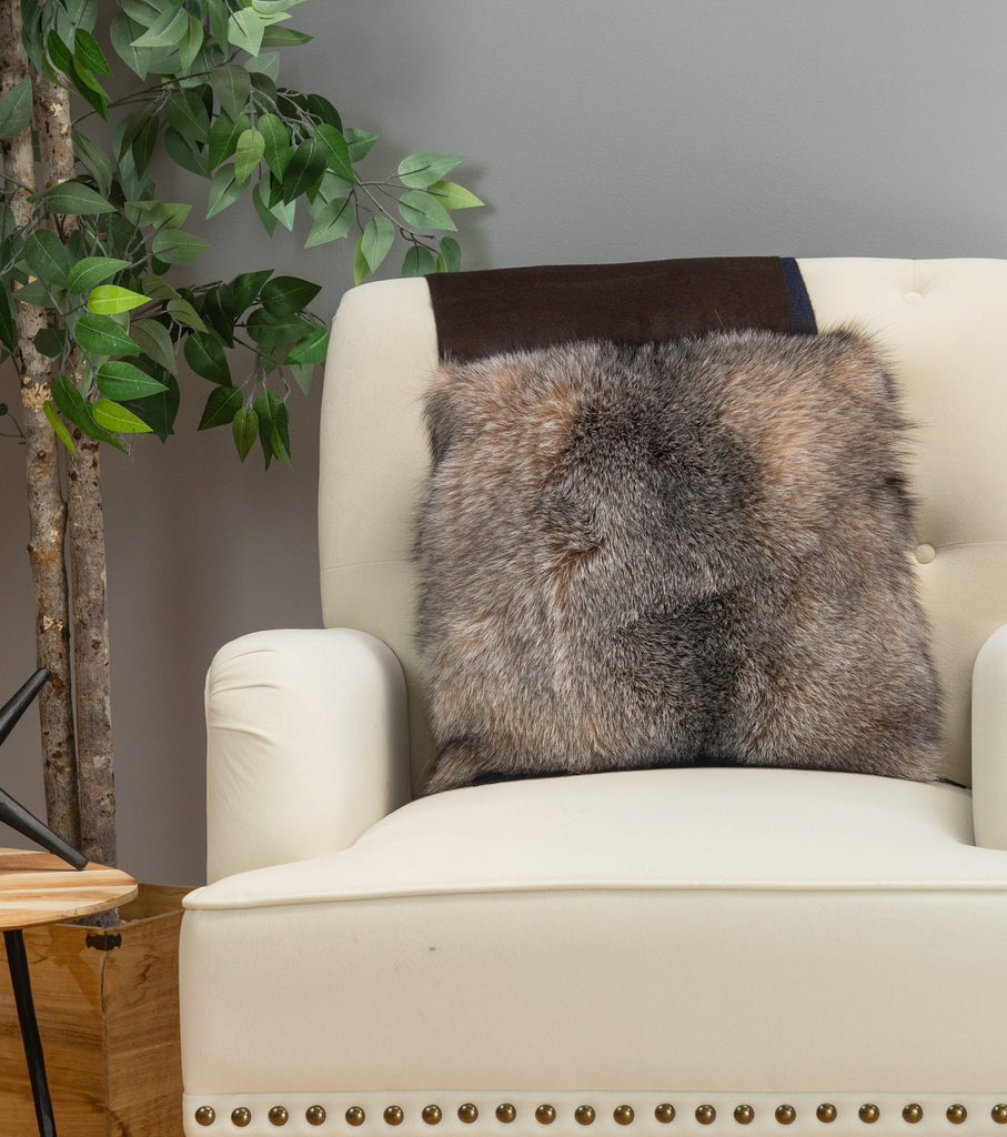 crystal fox fur pillow on white sofa chair in living room