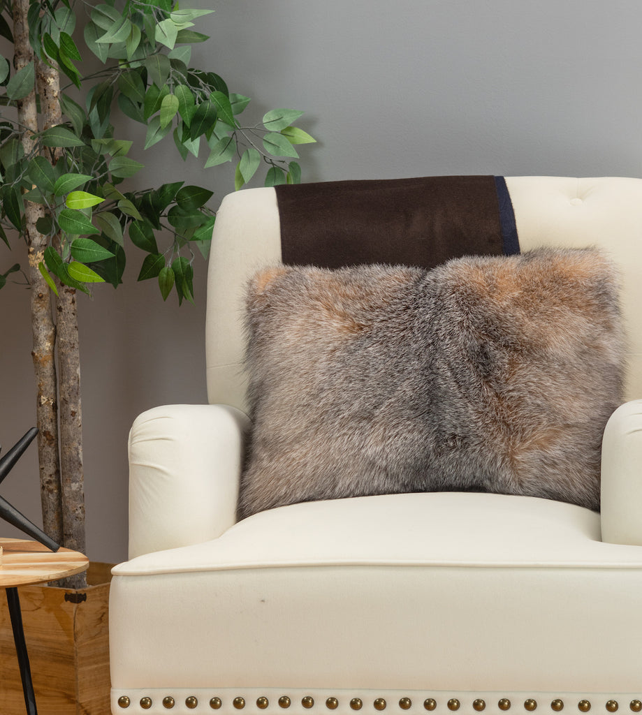 crystal fox fur pillow on white sofa chair in living room