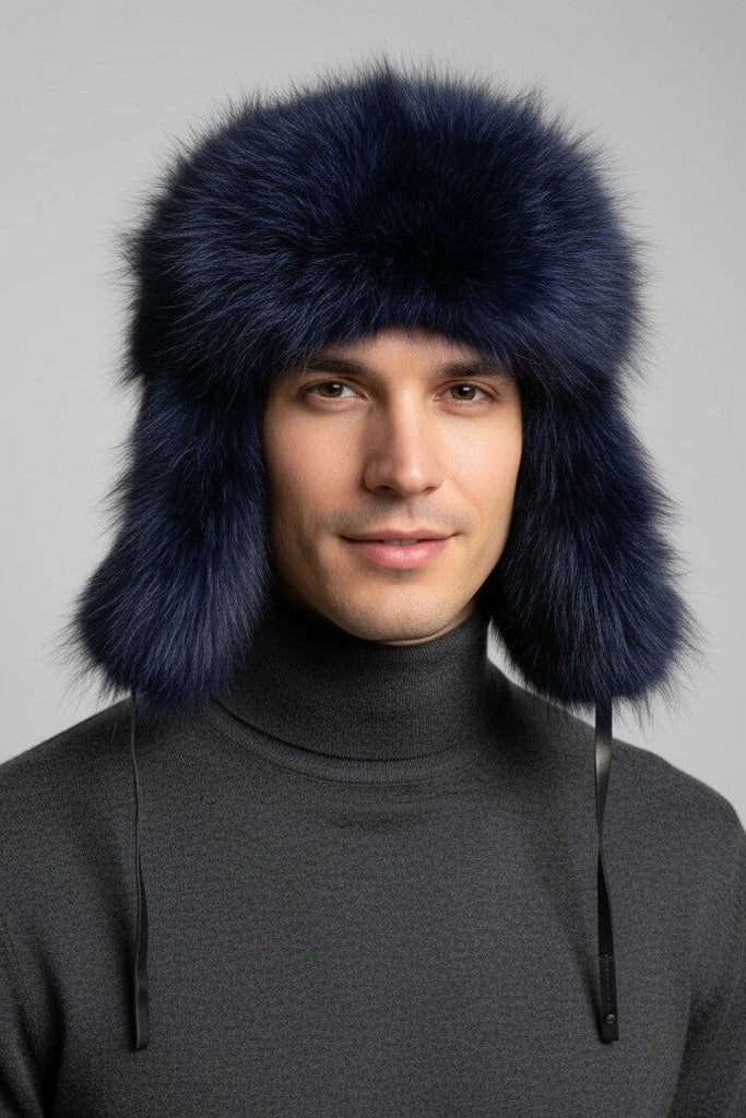 man wearing  cobalt blue dyed raccoon fur trooper hat and a grey sweater