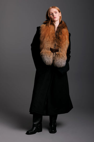 gold cross fox fur oversized collar with buckle closure worn over a black cashmere coat