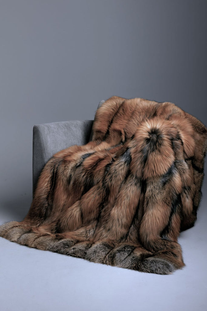 gold cross real fur blanket draped over grey chair cashmere backing. custom sizing and throw, queen, king