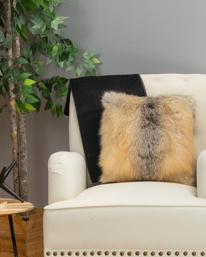 golden island fox fur pillow on white sofa chair in living room