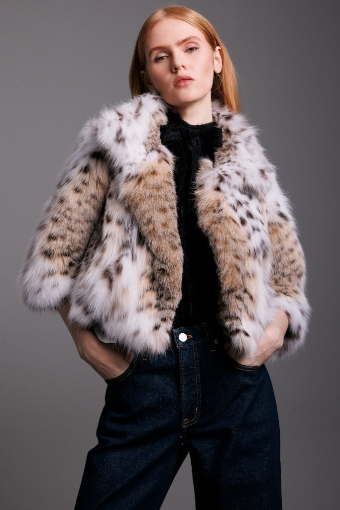 lynx bolero close up look on woman wearing all black