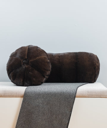 mahogany brown mink fur pillow set on bench for interior design