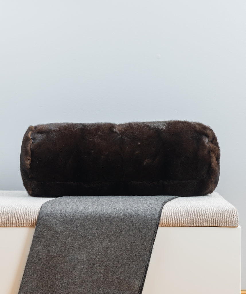 mahogany brown mink fur pillow bolster size on bench for interior design