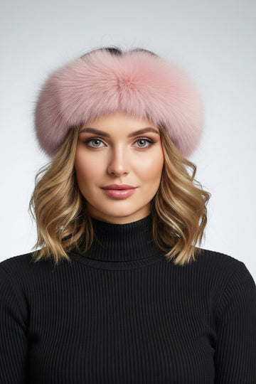 Woman wearing a pink dyed fox fur headband with a black sweater