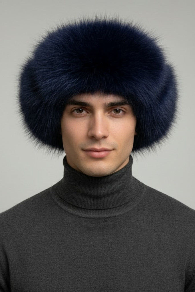 man wearing a dyed cobalt blue fur trooper hat and grey winter sweater