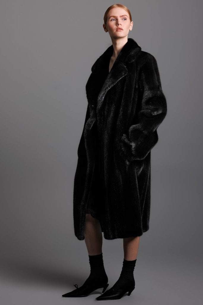 ranch mink style trench coat side detail view on woman wearing a silk dress