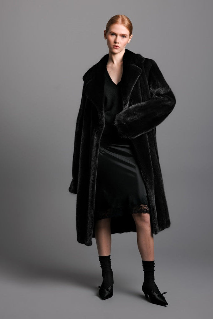 ranch mink trench coat on a woman wearing a silk dress