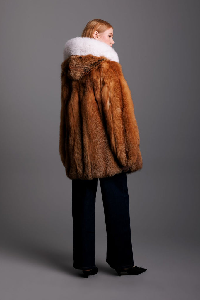 red fox fur parka with hood trim on hood back detail view on woman wearing dark jeans and kitten heels
