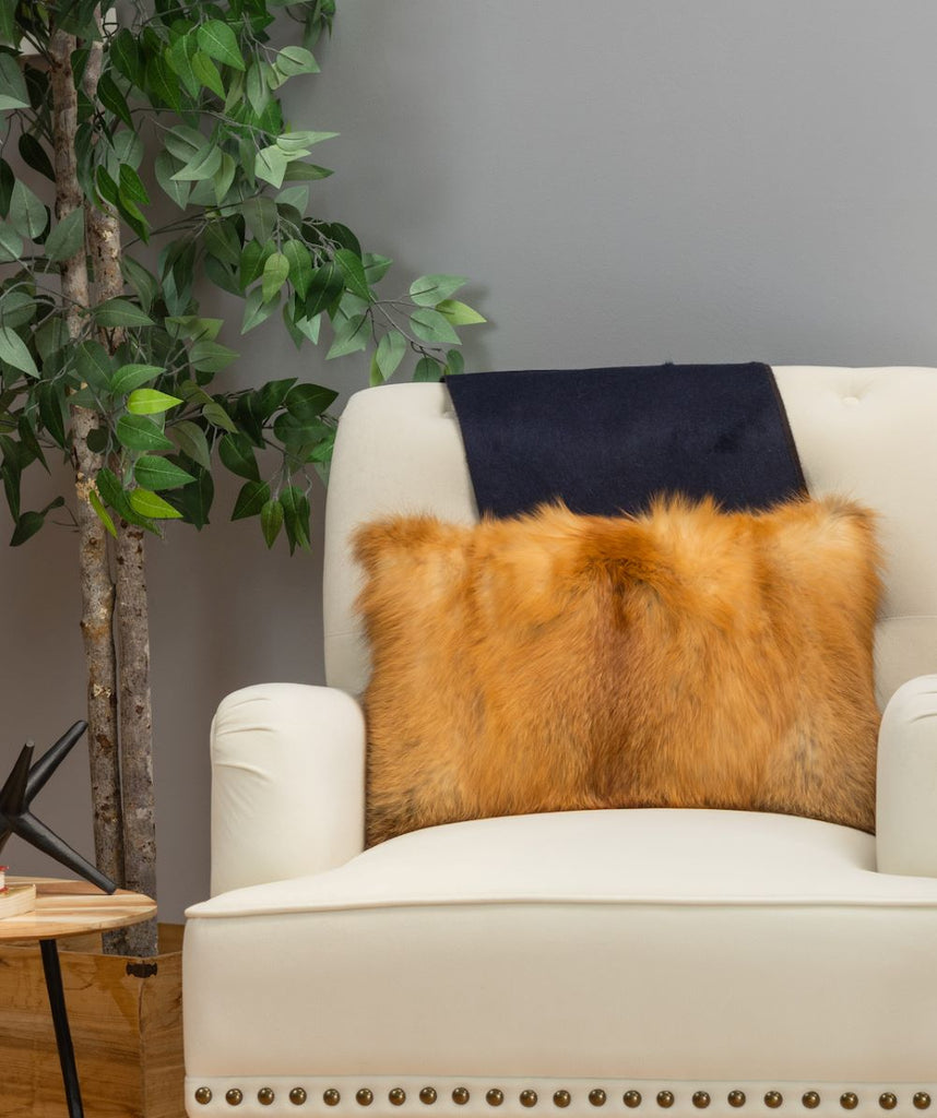 red fox fur boudoir pilow on a living room white chair