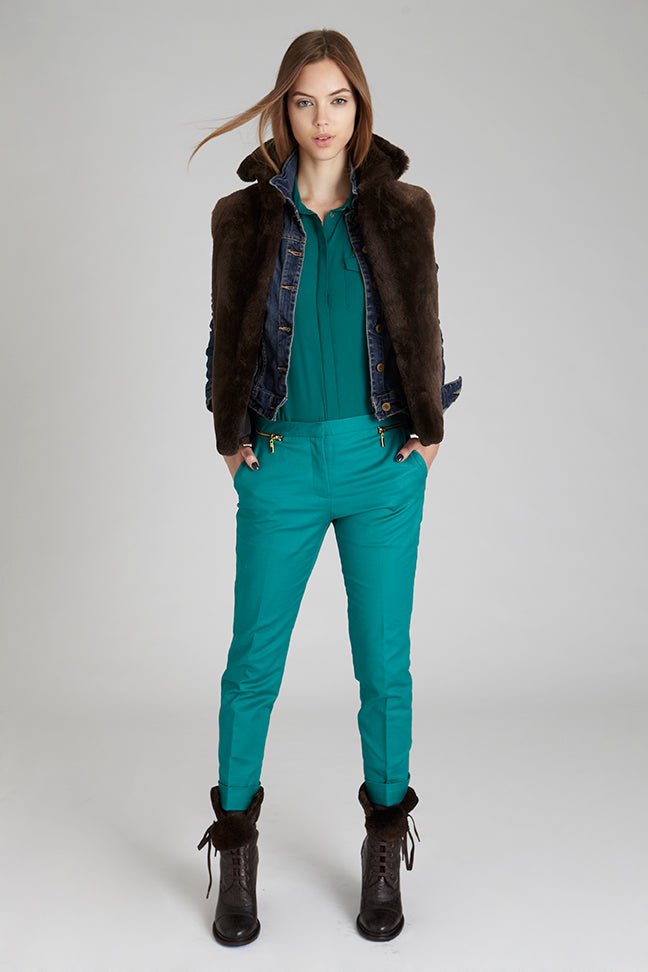 natural brown sheared beaver fur vest with stand up collar worn on model in green outfit