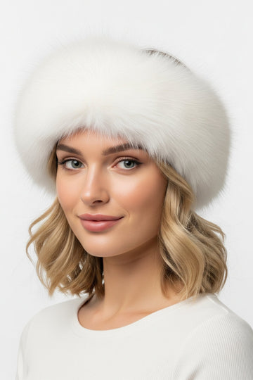 white fox fur headband on a woman wearing a white sweater