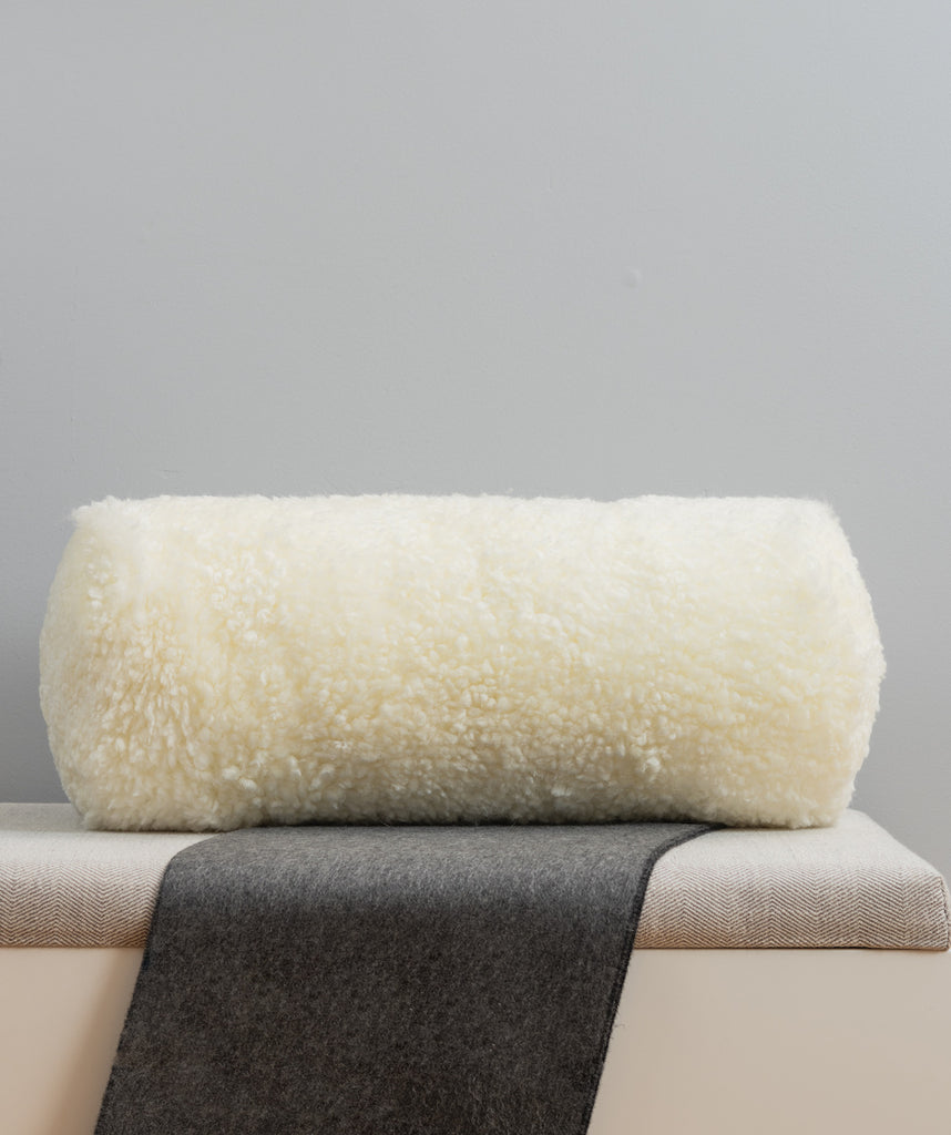 bolster size mohawi white shearling fur pillow on white bench for the living room