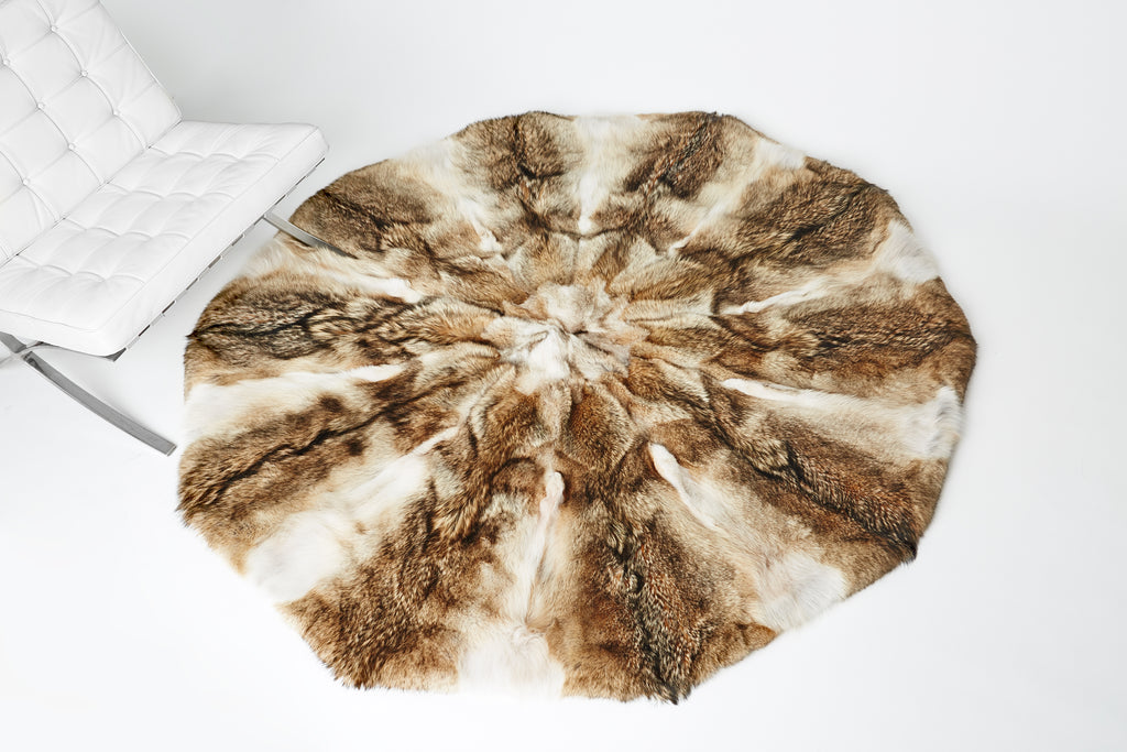 Coyote Fur Round Rug Design next to Barcelona Chair for home interior