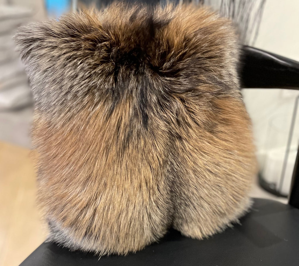 Cross Fox Fur Throw Pillow on Leather Couch in Living Room