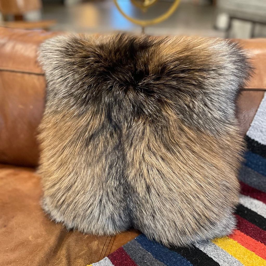 Cross Fox Fur Throw Pillow on Leather Couch in Living Room