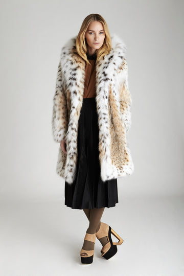 mid-length American lynx fur shawl collar jacket styled with long skirt and heels