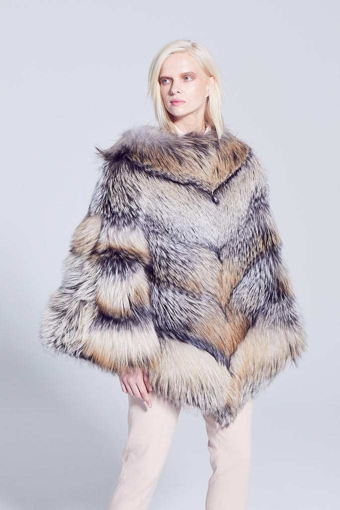 cross fox fur poncho worn over the head 