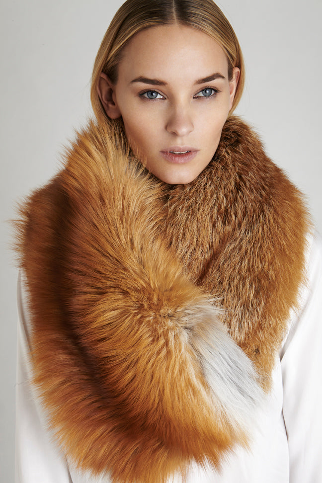 Gold fox fur oversized collar winter accessory worn over white blouse