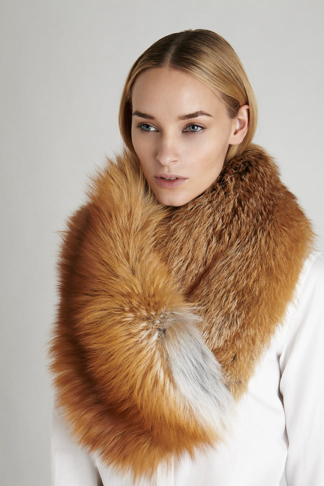 Gold fox fur oversized collar winter accessory worn over white blouse