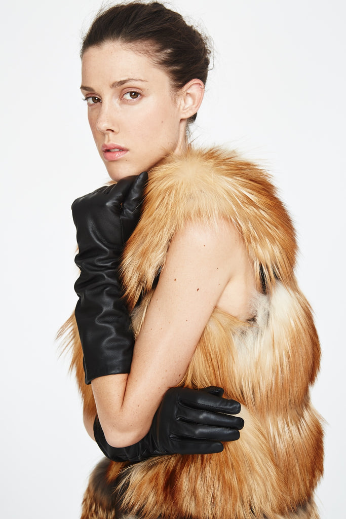 gold fox fur vest horizontally sectioned by mesh styled with  black leather gloves