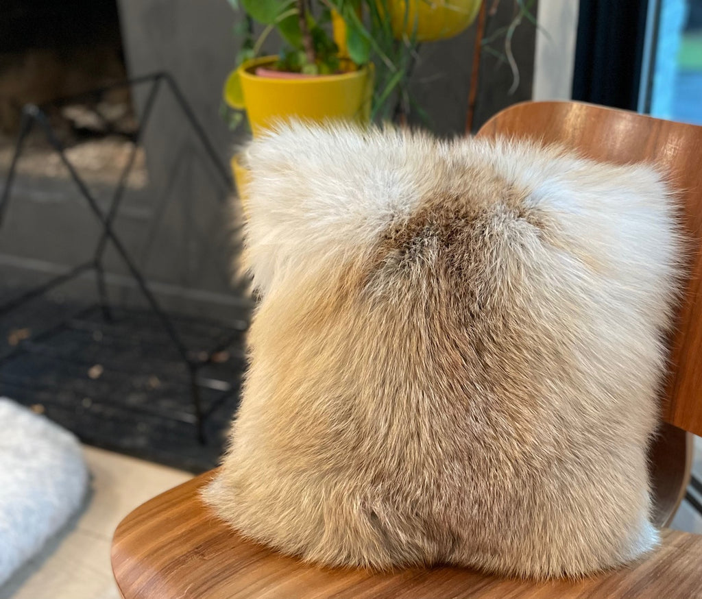 Golden Island Fox fur Pillow near fireplace interior design