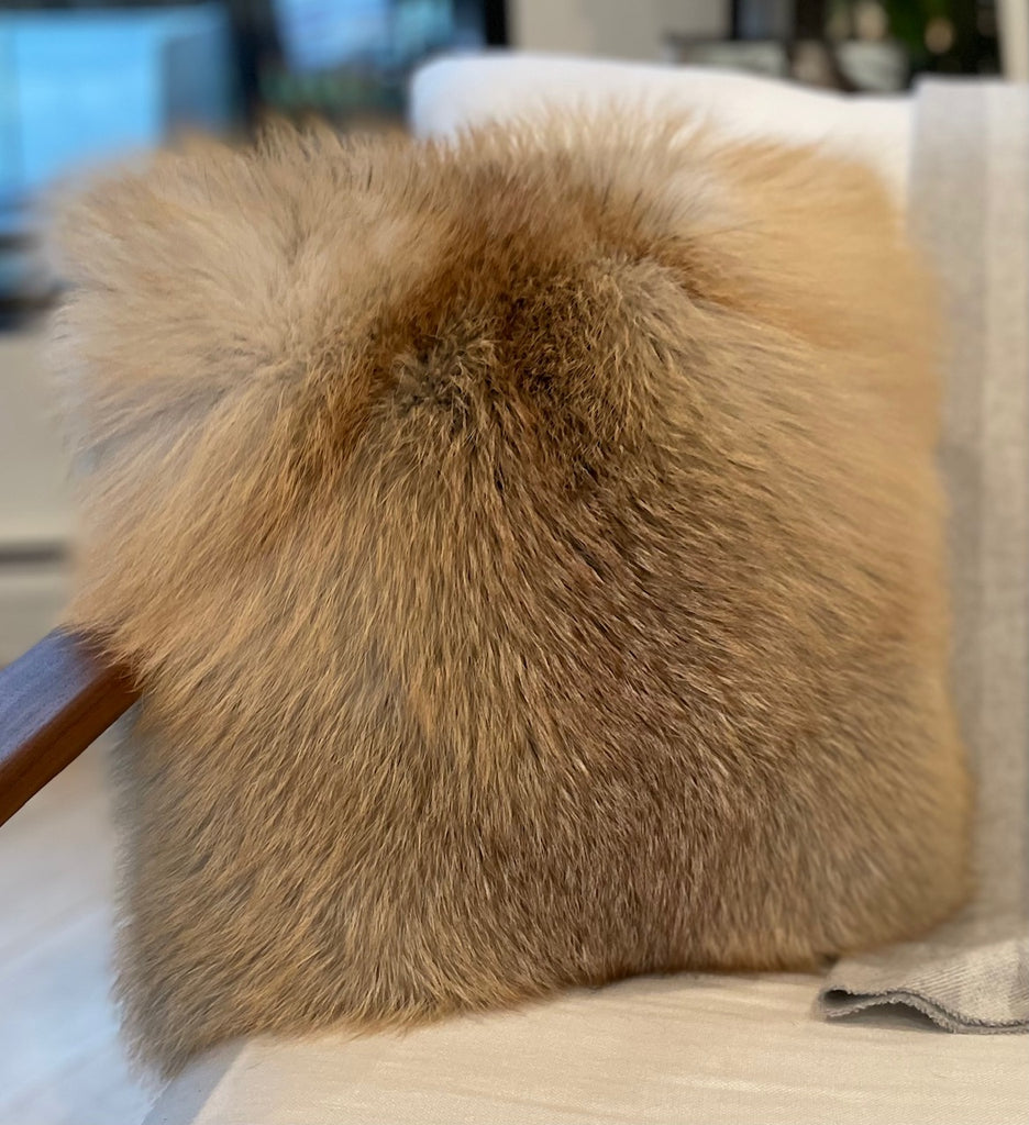 Golden Island Fox fur Pillow on leather couch interior design