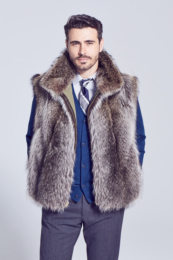 Mens raccoon fur vest with zipper closure and reversible to rainproof lining worn over a sweater