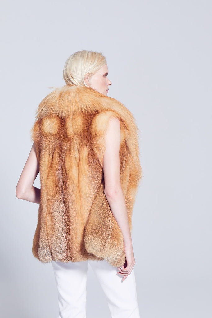 Gold Fox and Red fox fur Vest with shawl collar back close up fur detail worn over winter white pants