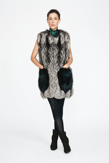 silver fox fur vest with accent emerald green fox fur pockets worn on model