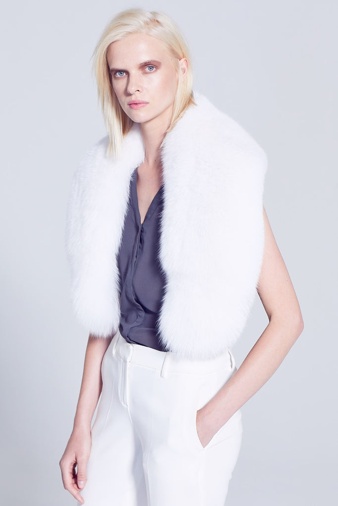 White Fox Fur Collar winter accessory worn over a silk shirt and winter white pants